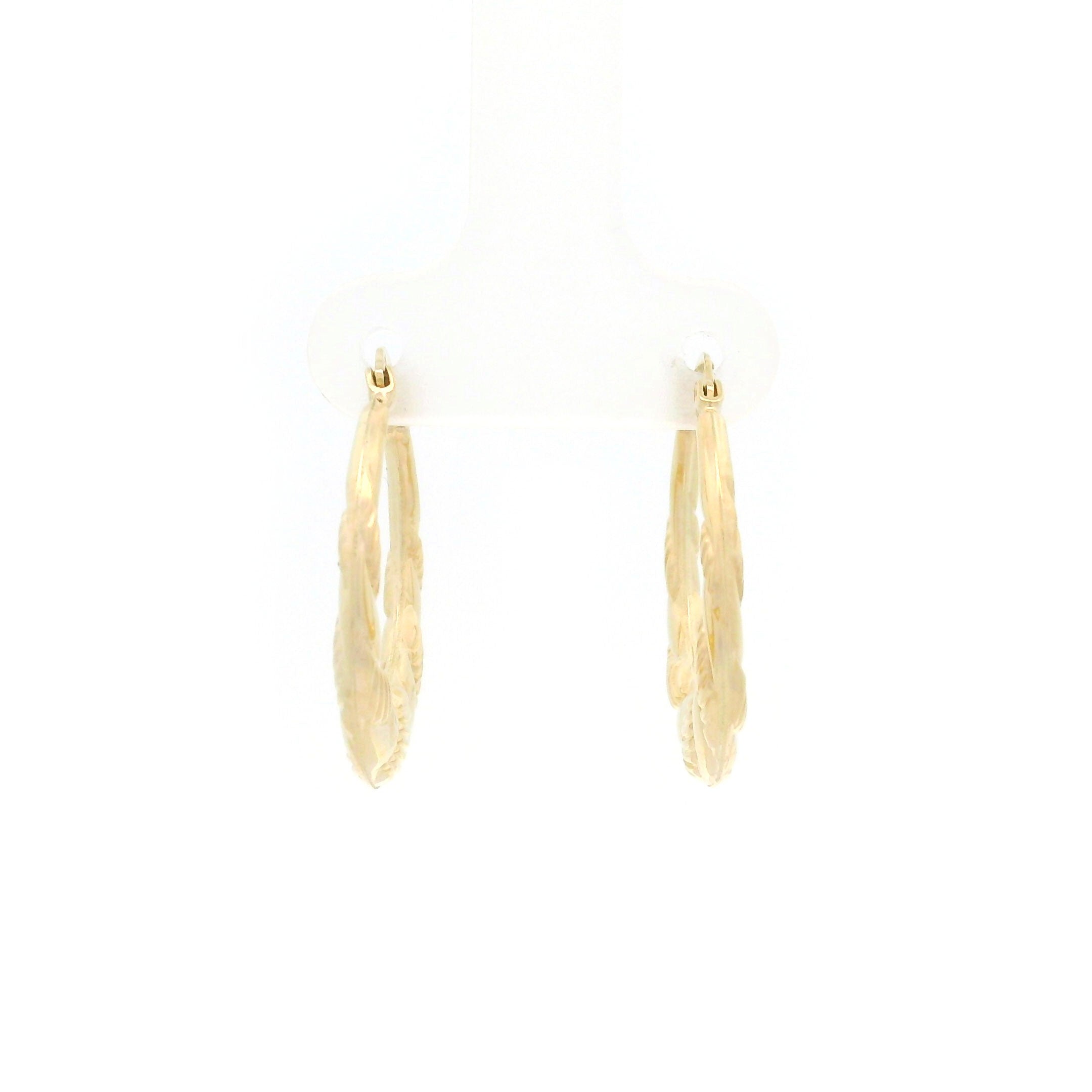 10k gold hoop earrings with swirl design on white background front view
