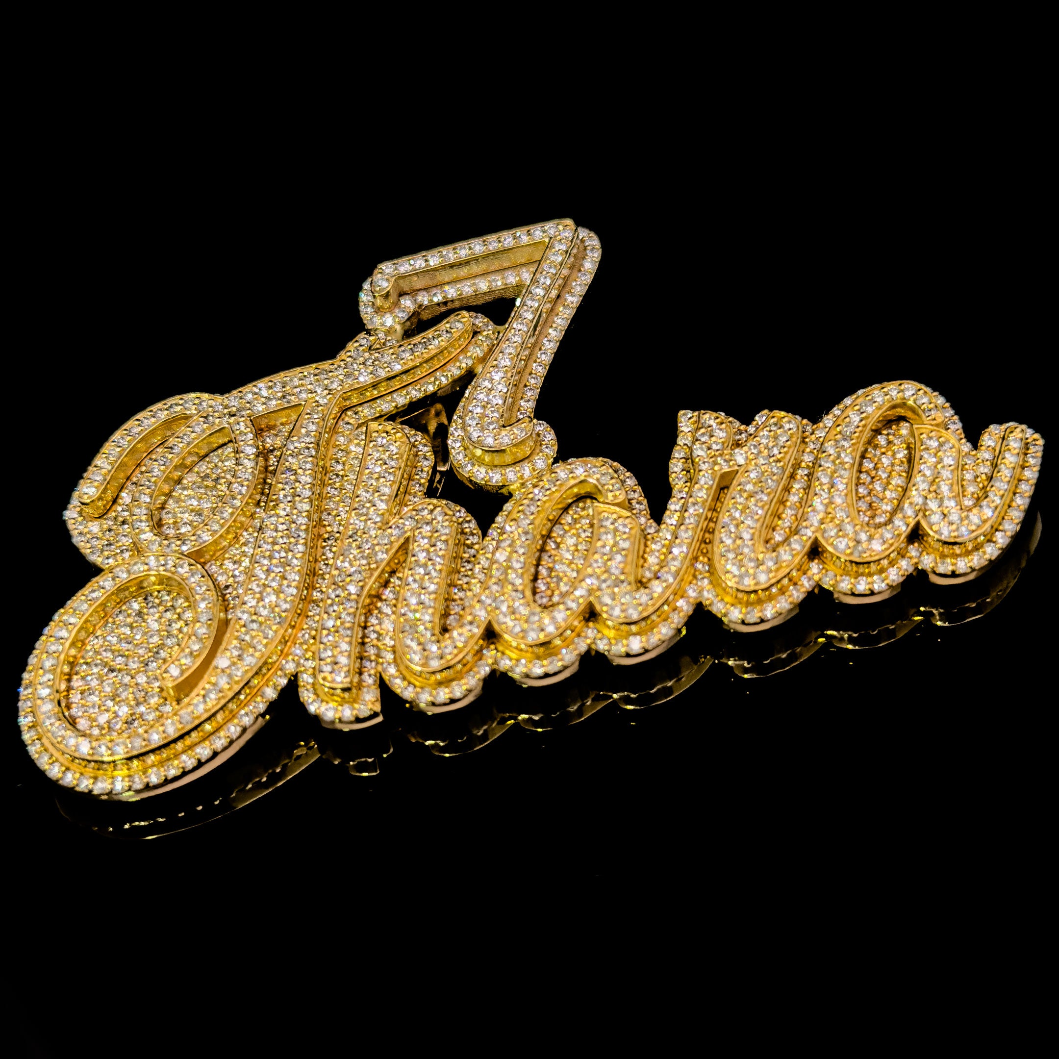 Gold-embellished 'Thara' nameplate on a black background