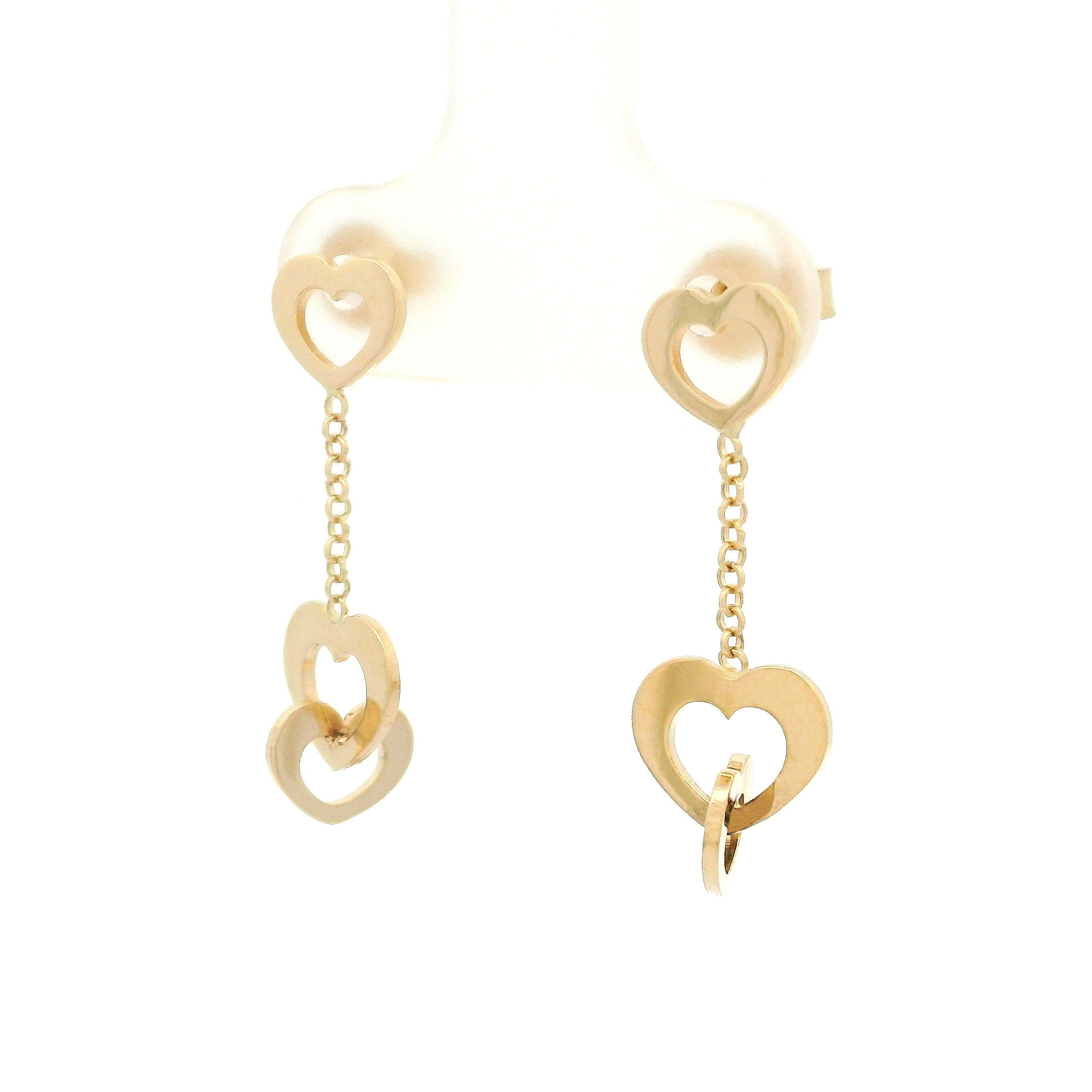 14k yellow gold triple heart and chain hanging earrings on white background