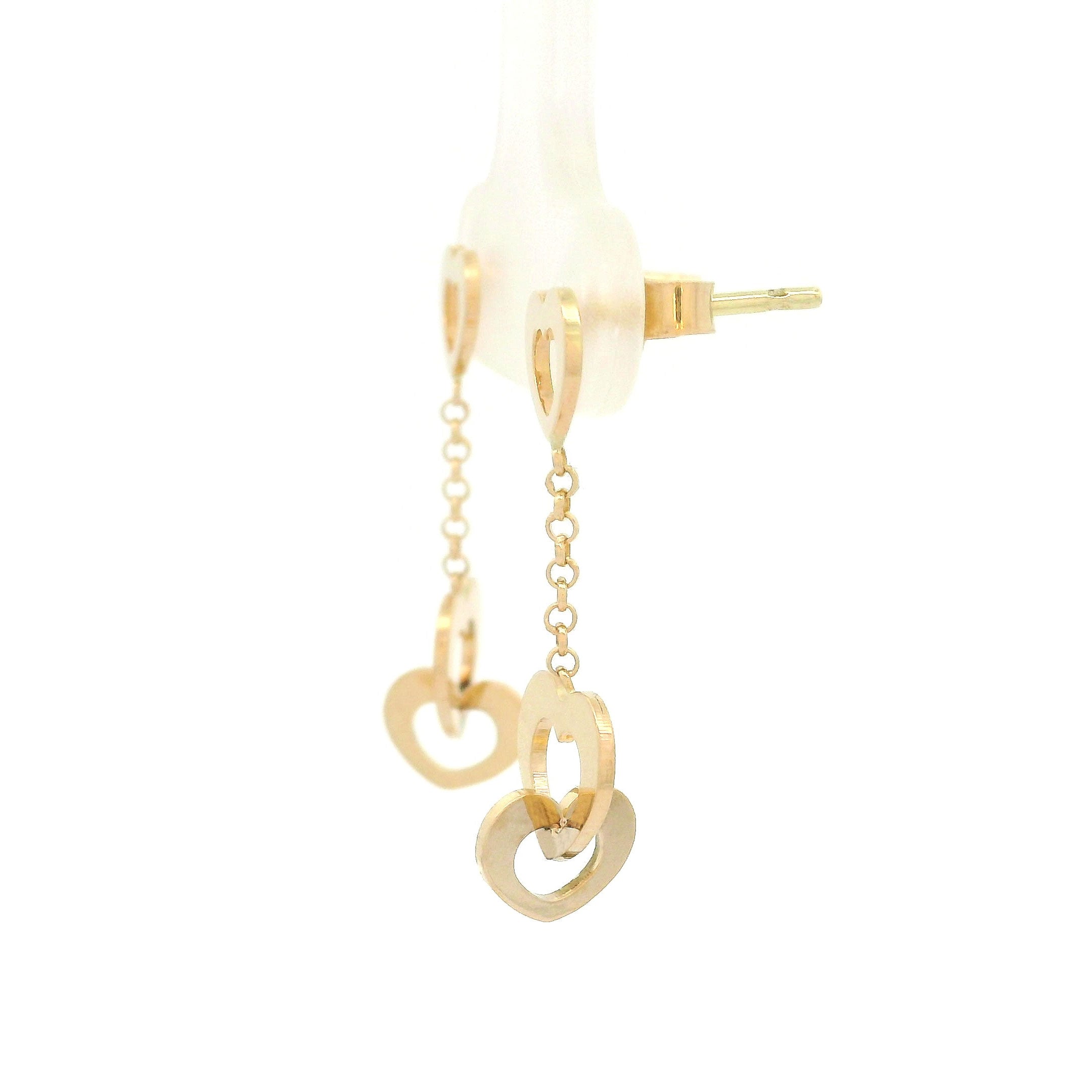 14k yellow gold triple heart and chain hanging earrings on white background side view