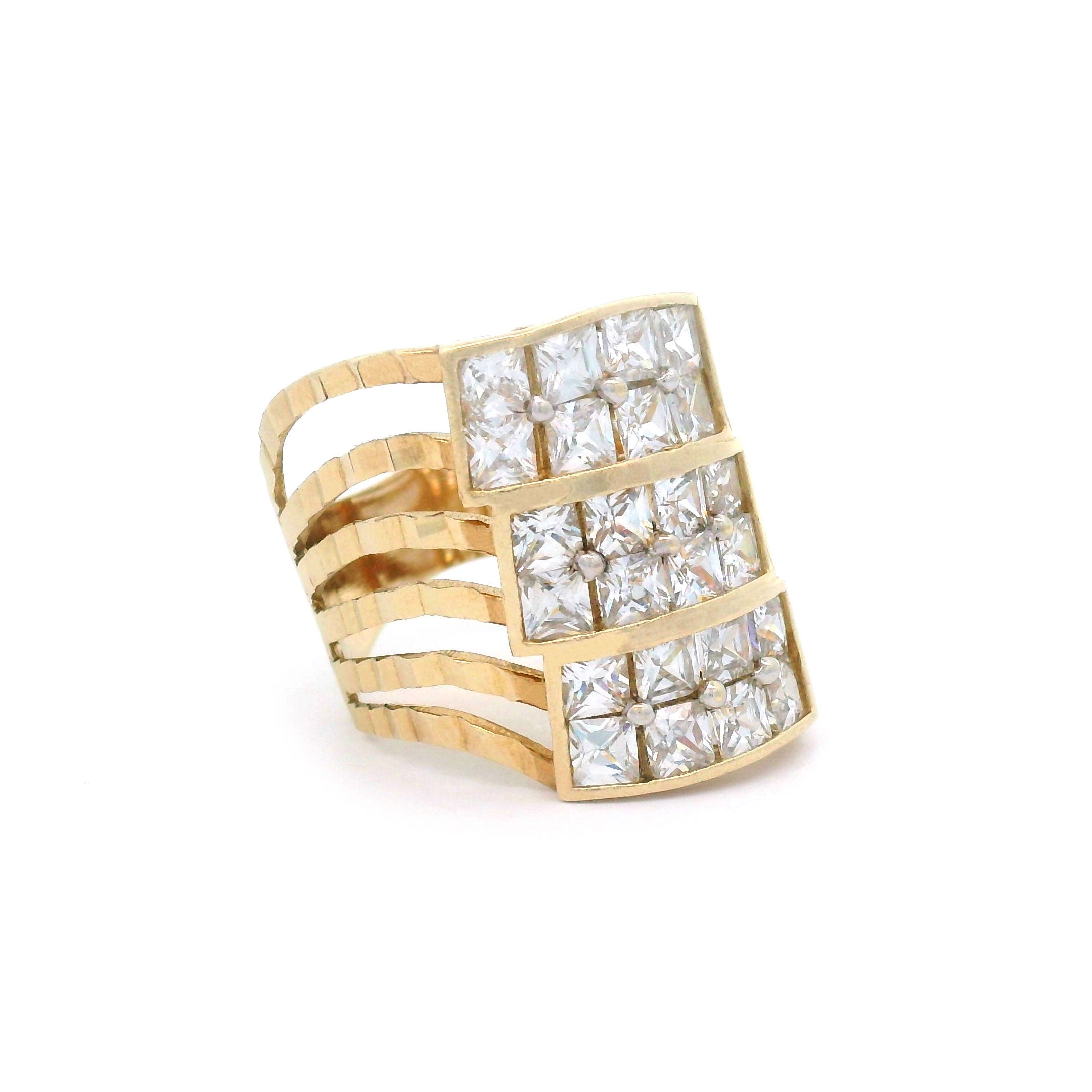 Gold ring with square-cut diamonds on a white background side