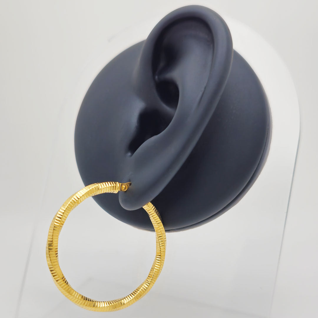 14k Laser Cut Twist Hoop Earrings on Ear Display