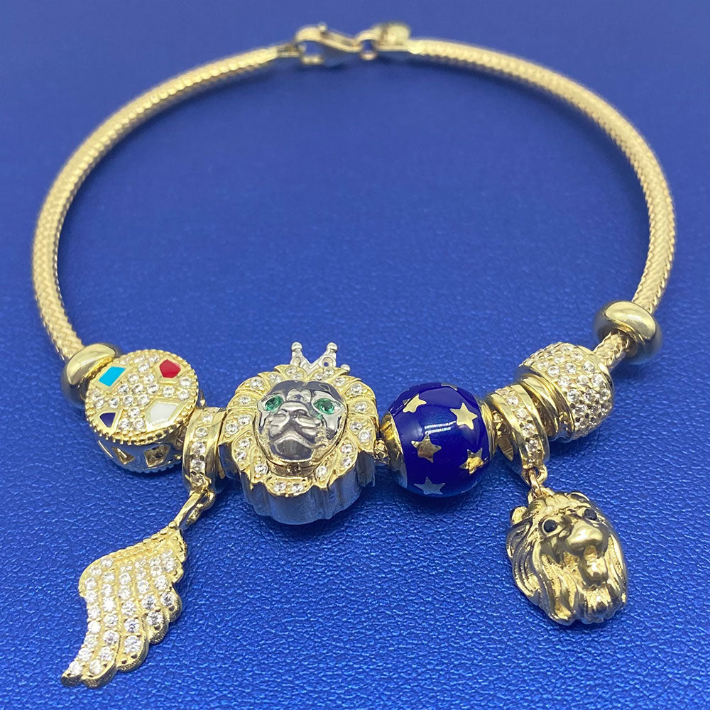10k CZ Fancy Lion & Angel Wing Charm Bangle Bracelet Blue Background